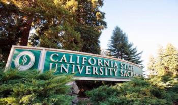 campus sign surrounded by trees 'california state university sacramento'
