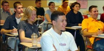 students smiling in classroom setting