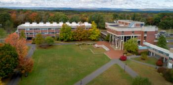 aerial view of a college campus with buildings and green spaces