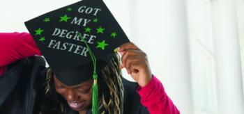 graduate adjusting cap with phrase 'got my degree faster'